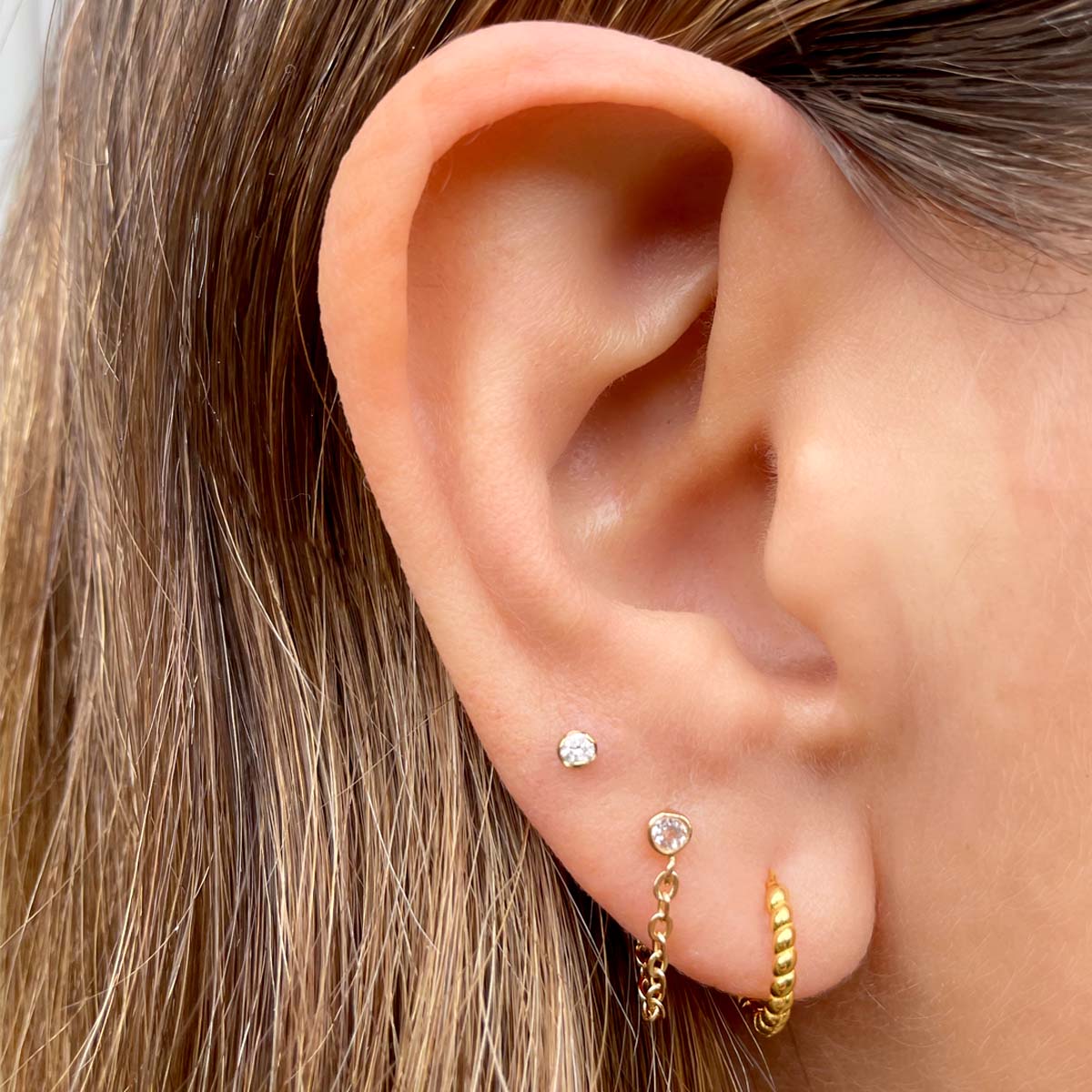 Kris Nations Twisted Hinged Huggie Earrings